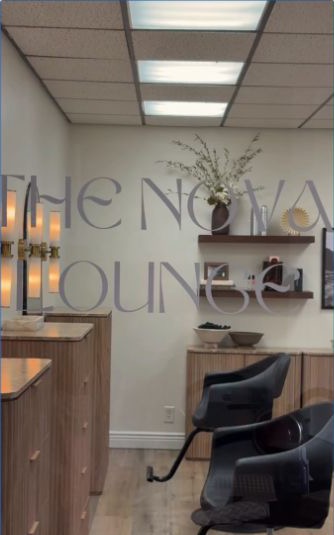 Styling chairs, warm wood cabinetry, and Nova Lounge lettering in the studio